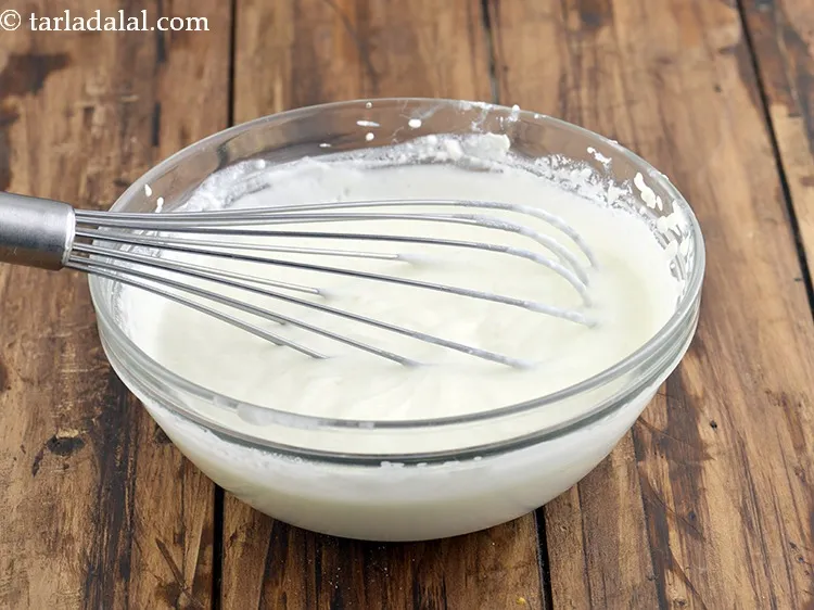 Step 24 – Mix well using a whisk. The use of a whisk ensures that the curd in …