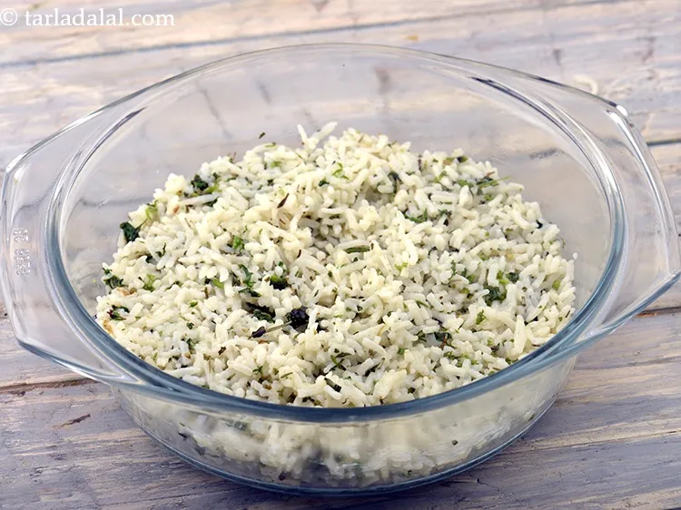 Step 66 – Put the rice and spread it evenly with the help of a spoon. Press it …