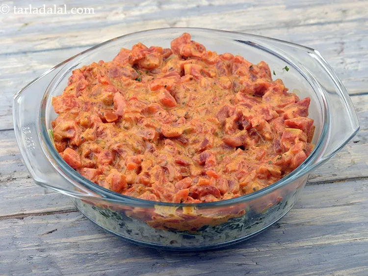 Step 68 – Pour the tomato gravy on top and spread it evenly with the help of a …