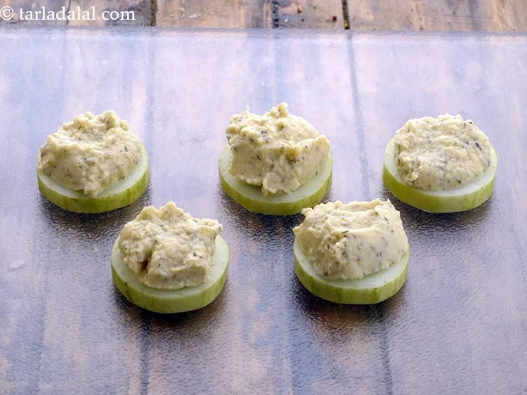 Step 31 – Top each cucumber slice with little topping mixture that is our hummus. If you have …