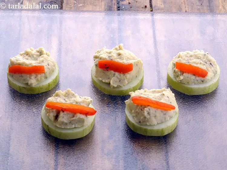 Step 32 – Garnish the cucumber bites with red capsicum strips