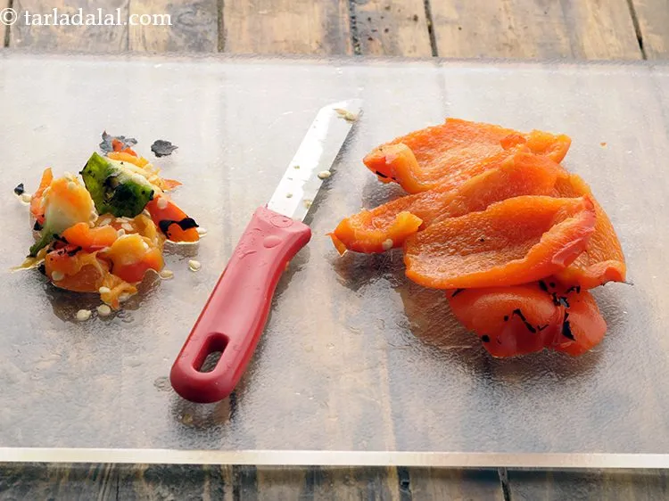 Step 8 – Place it on a chopping board and remove the stem and seeds. Discard it.