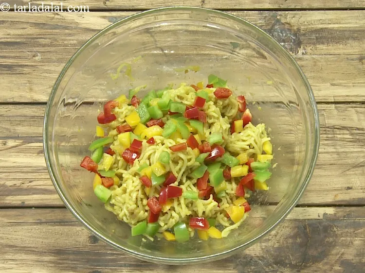 Step 8 – Once cooled, add 1/4 cup&nbsp;finely&nbsp;<a href="https://www.tarladalal.com/glossary-chopped-capsicum-164i">chopped capsicum</a>.