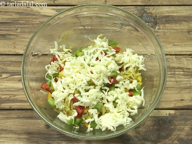 Step 9 – Add 1/4 cup&nbsp;<a href="https://www.tarladalal.com/glossary-grated-processed-cheese-868i">grated processed cheese</a>.