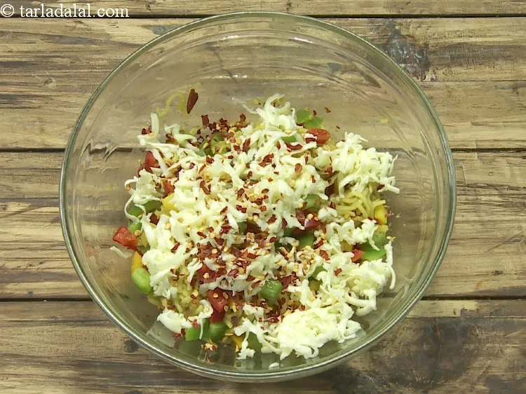 Step 10 – Add 1 tsp&nbsp;<a href="https://www.tarladalal.com/glossary-dry-red-chilli-flakes-paprika-338i">dry red chilli flakes (paprika)</a>.