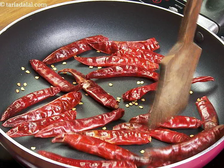 Step 15 – Dry roast on a medium flame for 2 minutes or till they turn crispy. Ensure …