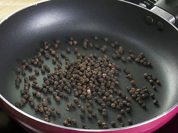 Step 6 – In the same pan, add the black peppercorns for some heat.