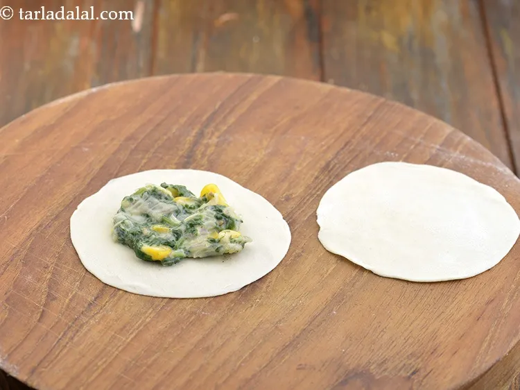 Step 40 – Place a portion of the rolled dough circle on a clean, dry surface and place …