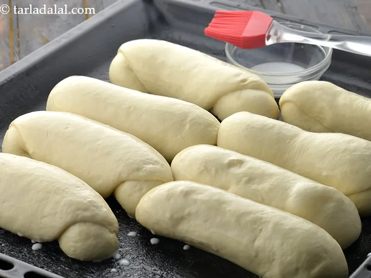 स्टेप 27 – मलमल का कपड़ा हटा दें। आप देखेंगे कि बन्स का …