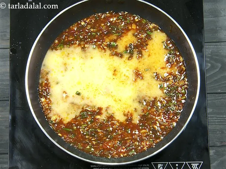 Step 15 – Add the cornflour-water mixture. Whisk the slurry very well before adding into the hot sauces …