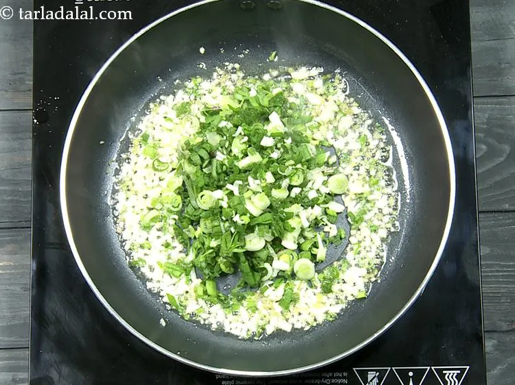 Step 10 – Add the spring onions.