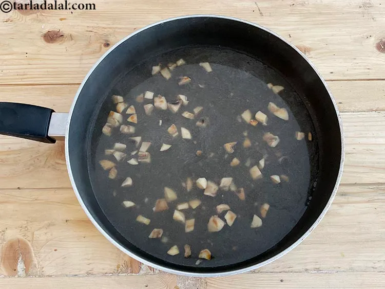 Step 10 – Cook <strong>mushroom tea | Indian style quick mushroom tea |&nbsp;healthy mushroom tea |&nbsp;</strong>on a slow …