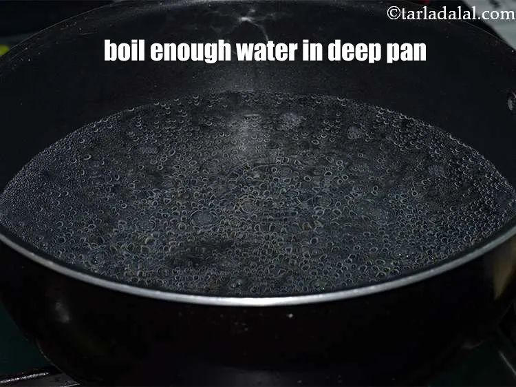 Step 13 – <meta charset="UTF-8" />Take a deep pan, add water to it and put it for boiling.&nbsp;Add …