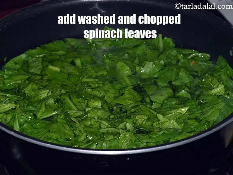 Step 14 – <meta charset="UTF-8" />Once the water comes to boil, add the washed and chopped spinach leaves.&nbsp;