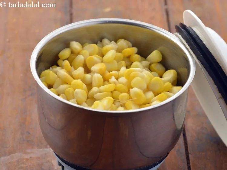 Step 14 – Once it cools down, transfer the kernels to a mixer jar.