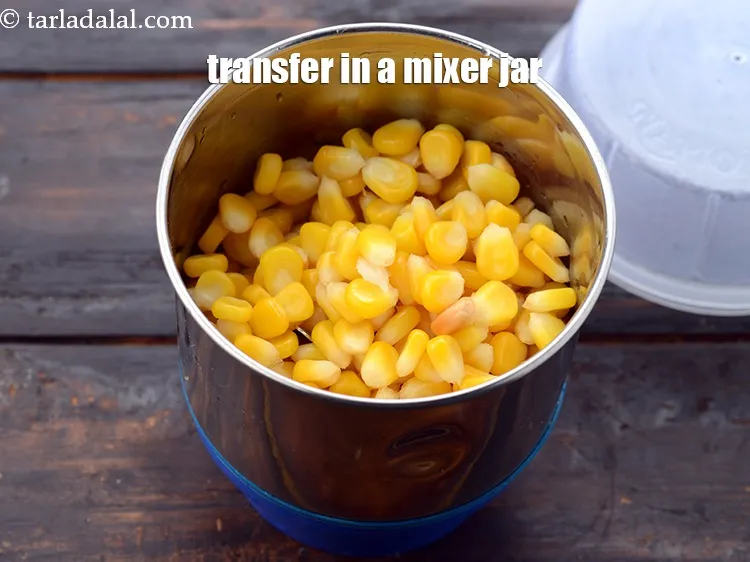 Step 10 – Trasnfer the boiled sweeet corn kernels in a mixer.