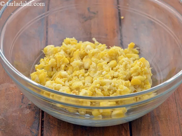 Step 23 – Add 1 1/4 cups&nbsp;<a href="https://www.tarladalal.com/glossary-boiled-and-crushed-sweet-corn-kernels-1930i">boiled and coarsely crushed sweet corn kernels</a>&nbsp;(makai ke dane). Remember to …