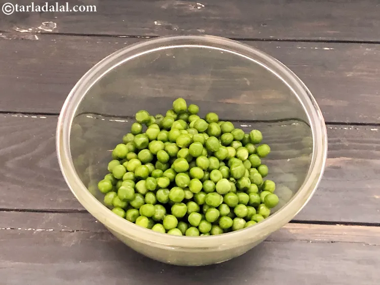 Step 28 – Take 1/4 cup of green peas.