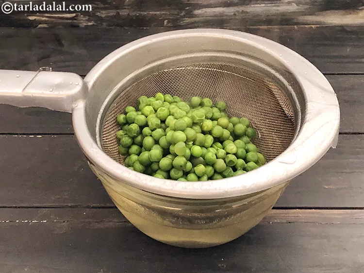 Step 37 – Add 1/4 cup&nbsp;<a href="https://www.tarladalal.com/glossary-boiled-green-peas-1078i">boiled green peas</a>.