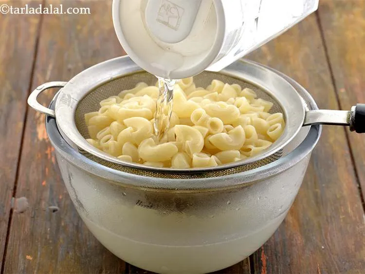 Step 21 – Refresh the macaroni under cold water. This ensures that they stop cooking.