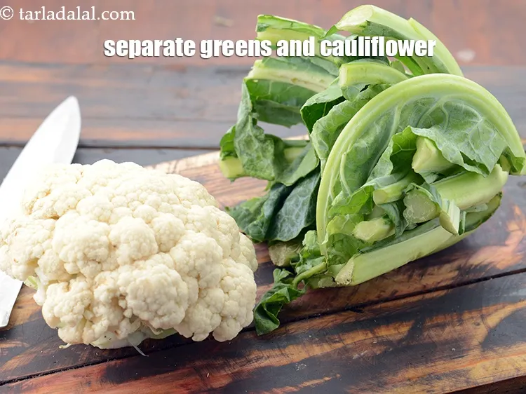 Step 11 – Separate the greens and the cauliflower using a big sharp knife.&nbsp;
