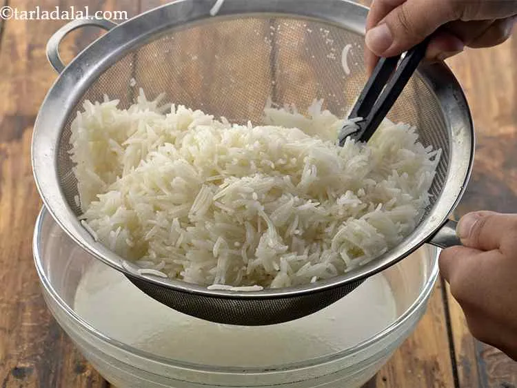 Step 20 – Toss the rice in it. Ensure each grain is coated well with oil.