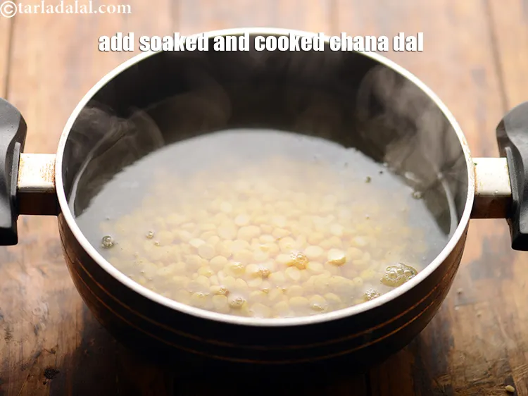 Step 15 – Add 1/4 cup&nbsp;<a href="https://www.tarladalal.com/glossary-soaked-chana-dal-1381i">soaked chana dal (split bengal gram)</a>.
