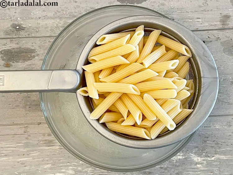 Step 10 – <html><head><meta charset="UTF-8"></head><body><p>Immediately drain the cooked pasta into a sieve or a colander.&nbsp;</p></body></html>