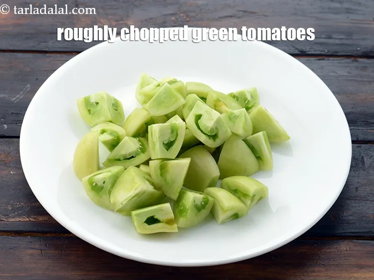 Step 9 – This is&nbsp;1 cup&nbsp;roughly&nbsp;<a href="https://www.tarladalal.com/glossary-chopped-green-tomatoes-2241i">chopped green tomatoes</a>.