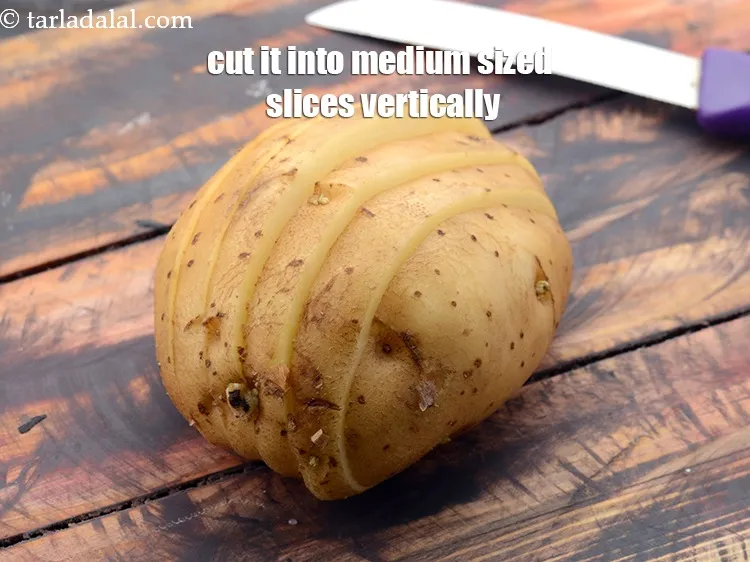 Step 14 – Place the potato on a chopping board horizontally and cut it into medium sized slices …