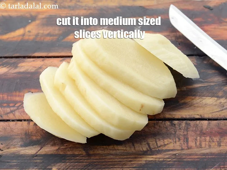 Step 5 – Place the potato on a chopping board horizontally and cut it into medium sized slices …