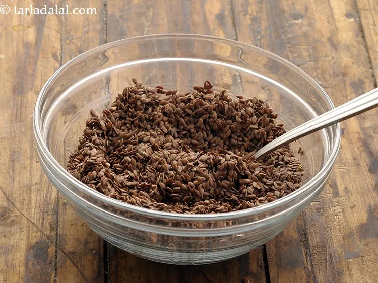 Step 12 – Mix all the ingredients of the <strong>flax seed mukhwas</strong> well using a spoon.&nbsp;