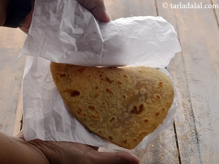 Step 25 – Once you wish to consume them, remove the butter paper from the parathas.