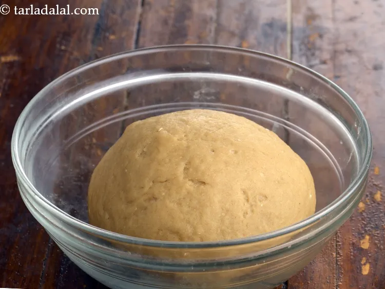 Step 7 – Knead into a semi-stiff dough. Divide the dough into 10 equal portions. Keep aside.