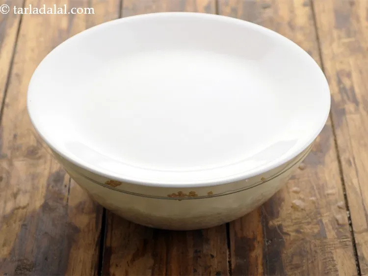 Step 6 – Enough water in a deep bowl and mix well. Cover with a lid and keep …