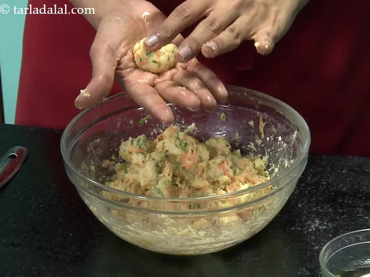 Step 19 – Divide the mixture into 16 equal portions. Grease your palms with a little oil and …