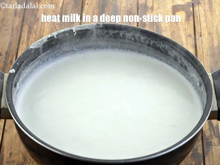Step 3 – Heat 4 cups of milk in a deep non-stick pan.