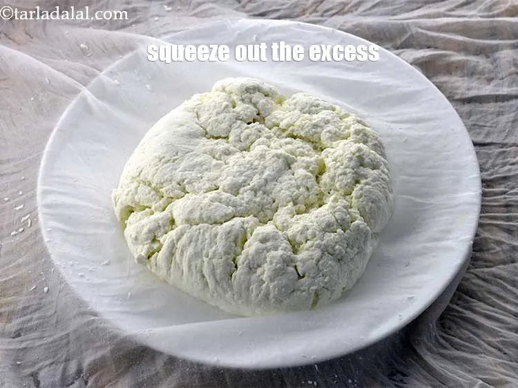 Step 8 – Squeeze out the excess water from the chenna.