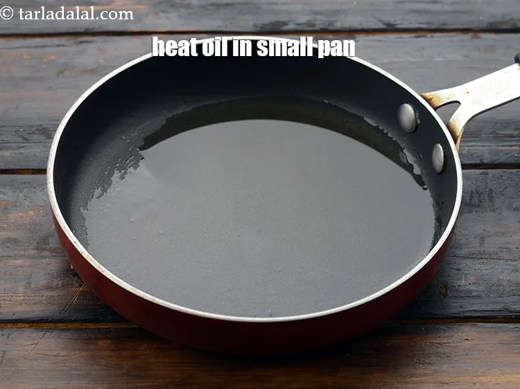 Step 48 – Heat 1 tbsp&nbsp;<a href="https://www.tarladalal.com/glossary-oil-671i">oil</a>&nbsp;in a small pan.