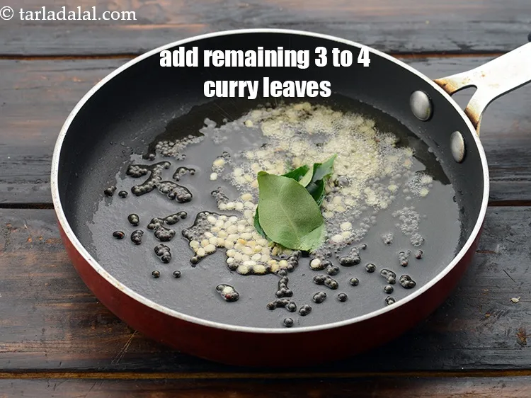Step 51 – Add the remaining 3 to 4 <a href="https://www.tarladalal.com/glossary-curry-leaves-kadi-patta-kadipatta-388i">curry leaves (kadi patta)</a>.&nbsp;