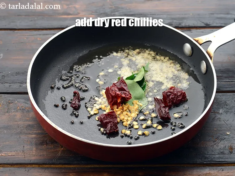 Step 52 – Add 1&nbsp;small&nbsp;<a href="https://www.tarladalal.com/glossary-whole-dry-kashmiri-red-chillies-kashmiri-mirch-kashmiri-lal-mirch-332i">whole dry kashmiri red chilli</a>&nbsp;, broken into pieces.&nbsp;