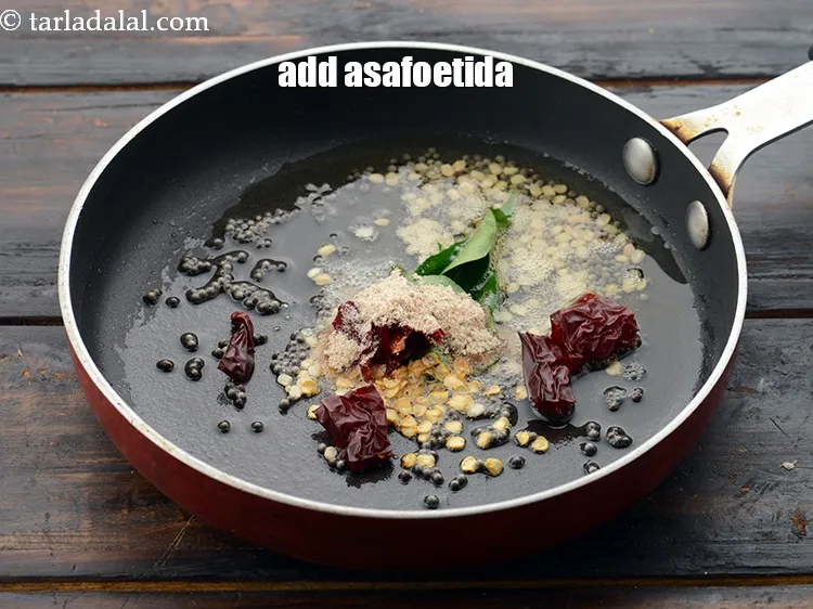 Step 53 – Add 1/4 tsp&nbsp;<a href="https://www.tarladalal.com/glossary-asafoetida-hing-113i">asafoetida (hing)</a>.&nbsp;
