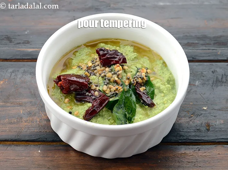 Step 55 – Pour this tempering over the coconut mixture.