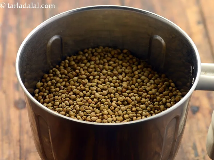 Step 8 – Transfer the roasted coriander seeds in a mixer jar.&nbsp;
