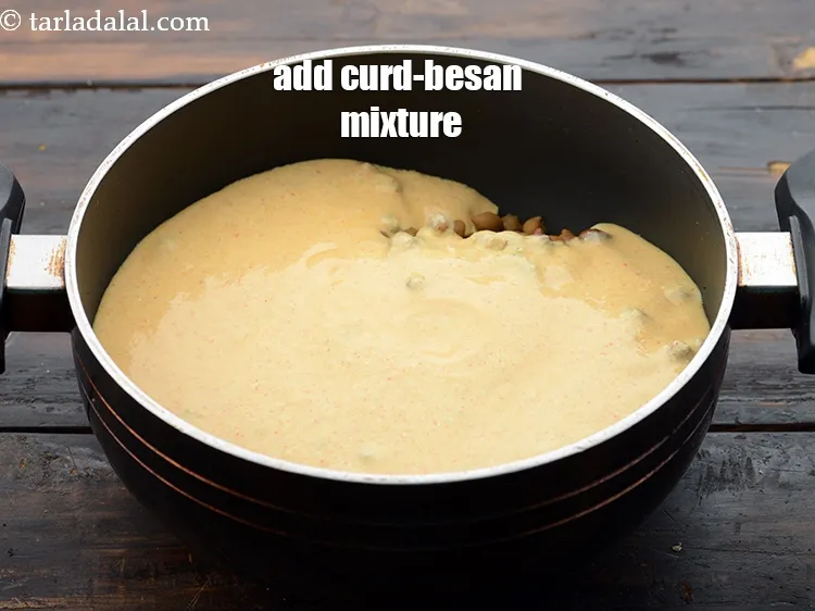 Step 27 – Add the curd-besan mixture.&nbsp;