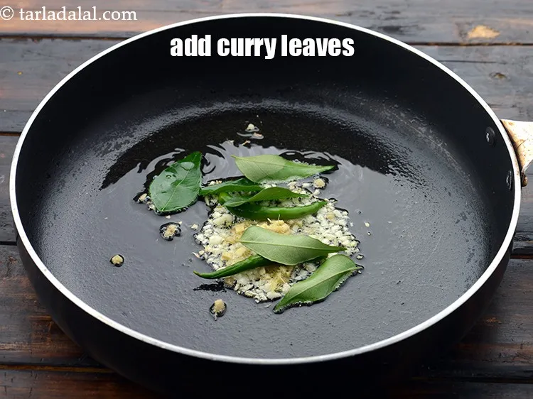Step 30 – Add 6&nbsp;<a href="https://www.tarladalal.com/glossary-curry-leaves-kadi-patta-kadipatta-388i">curry leaves (kadi patta)</a>.