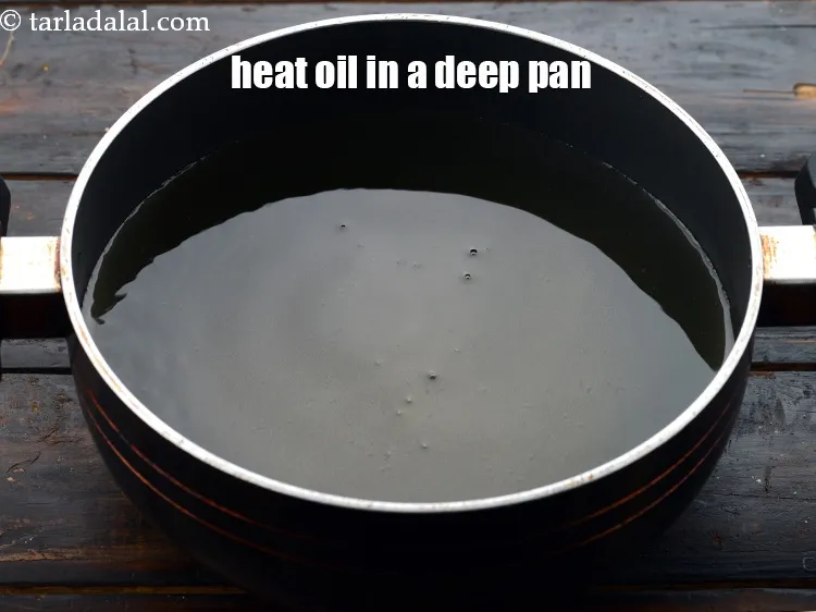 Step 23 – Heat the oil for deep-frying in a deep non-stick pan.&nbsp;