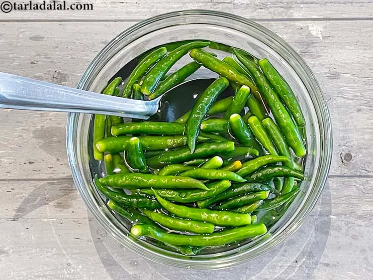Step 4 – Remove the dirt of &nbsp;the green chillies with a spoon as you want to avoid …