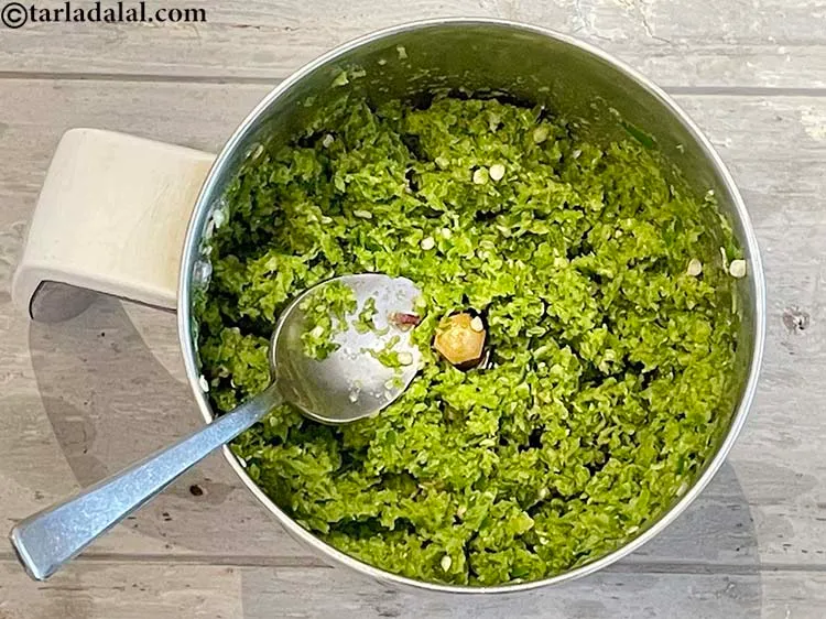 Step 9 – Use a spoon to bring the paste into the centre for better grinding.