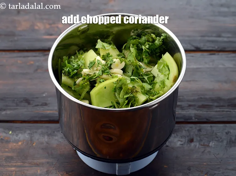 Step 13 – Add 2 tbsp&nbsp;<a href="https://www.tarladalal.com/glossary-chopped-coriander-783i">chopped coriander (dhania)</a>.&nbsp;